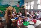 Babinsa Kodim 0301/Pbr Lakukan Pendampingan Pemberian Makan Siang Bergizi